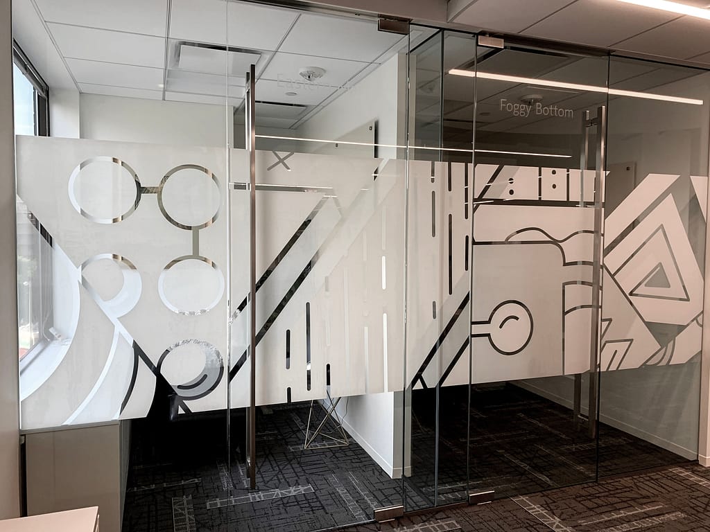 Custom printed Solyx iQ window film installed on office glass and doors.