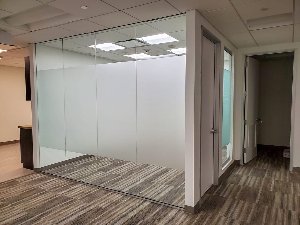 Etched window film applied to a small conference room glass wall.