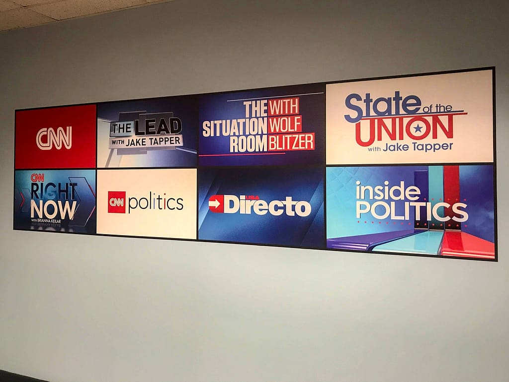 Simple shaped low tack wall vinyl graphic made up of 8 different CNN logos.