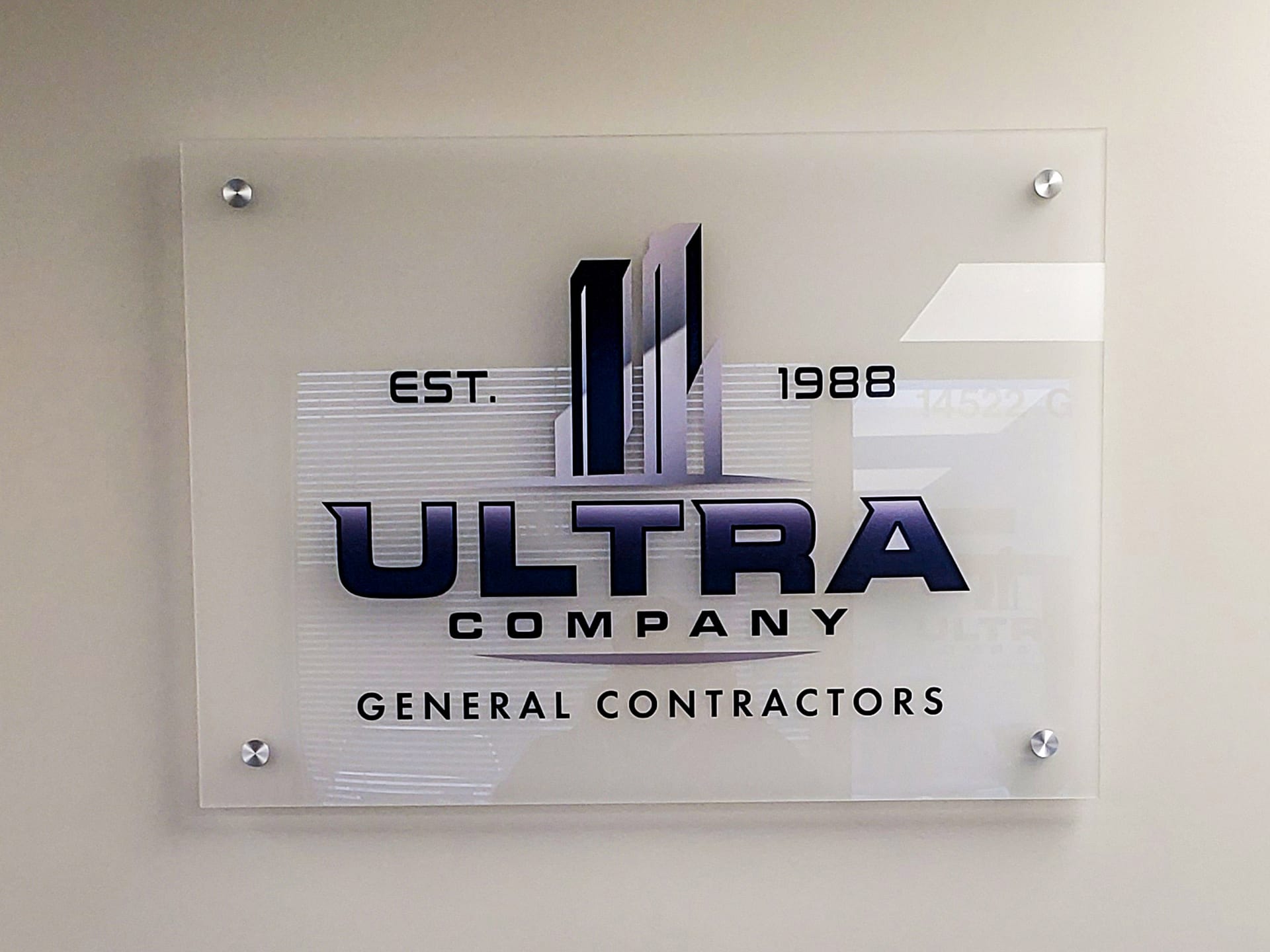 Frosted acrylic sign with a full color logo adhered to the face.